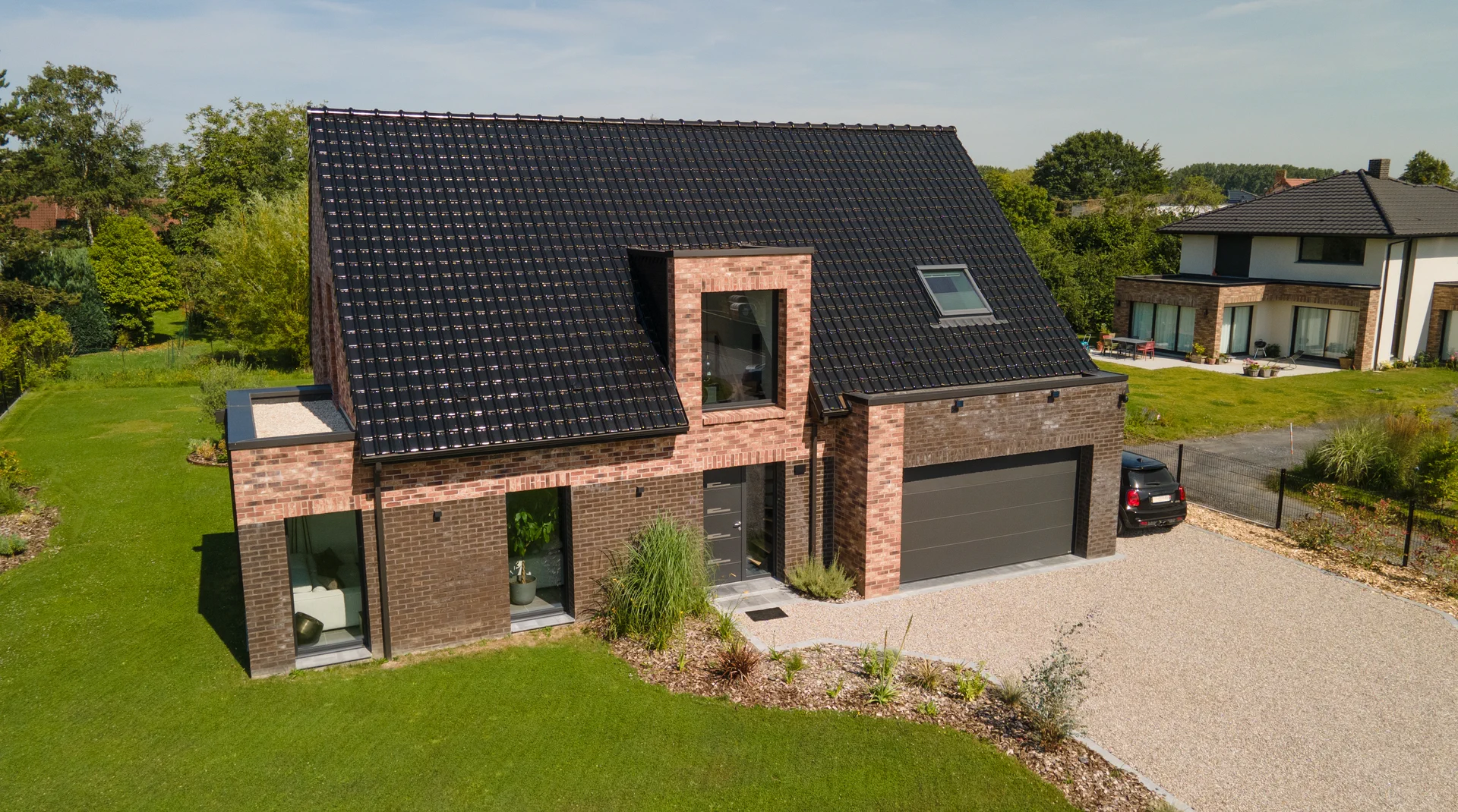 Maison individuelle en brique construite par Maisons d'en Flandre, vue aérienne du jardin